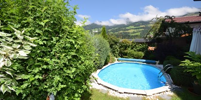 Pensionen - Art der Pension: Privatzimmervermietung - Brixen im Thale - Garten - Golf & Ski Chalet****