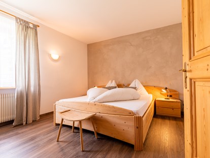 Pensionen - Art der Pension: Urlaubspension - Trentino-Südtirol - Schlafzimmer 2 Gardensuite Apartment LATEMAR - Haus Christian 
